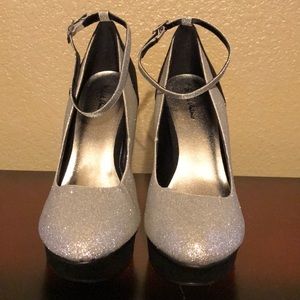 Black and silver Michael Antonio platform heels